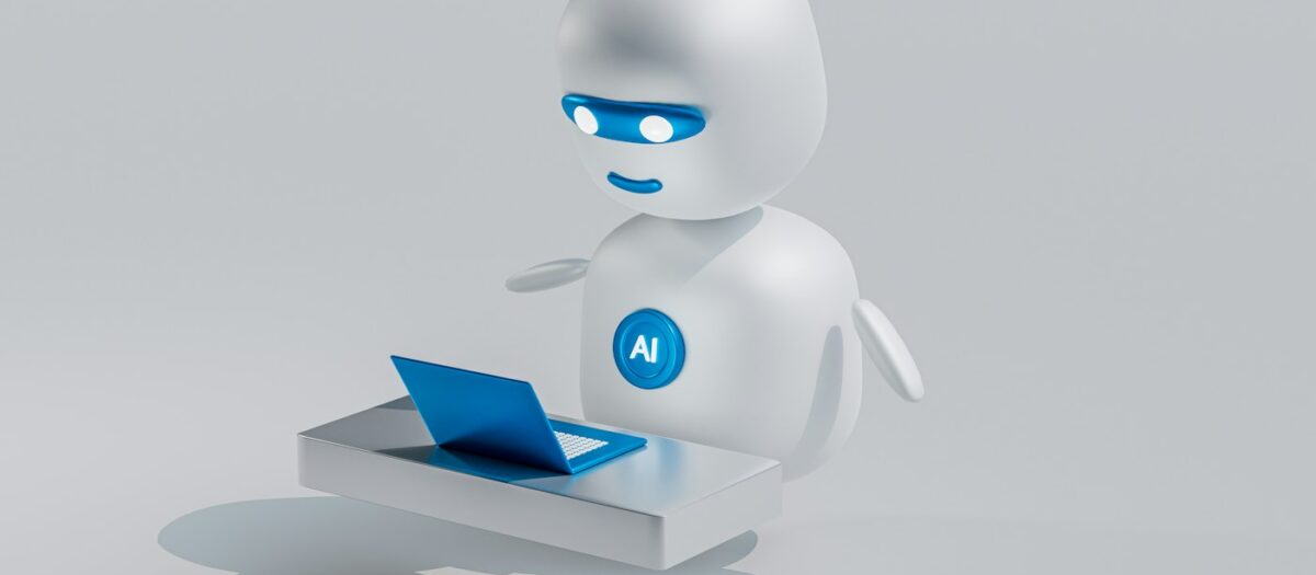 작은 노트북 앞에서 일하는 하얀 AI 로봇 캐릭터